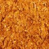 Textura macro de las escamas Tetra Betta Mini Flakes, un alimento premium para peces luchadores de Siam.