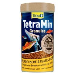 Envase de TetraMin Gránulos, alimento completo para peces de agua dulce con ingredientes naturales.