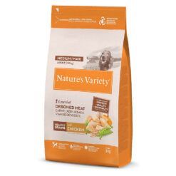 Bolsa de pienso para perros adultos Nature's Variety Healthy Grain Medium Maxi Pollo con diseño moderno. Muestra una imagen atractiva del producto junto a ingredientes naturales como pollo, cereales saludables, frutas y verduras. Destaca sus beneficios nutricionales y su fórmula equilibrada para la salud y bienestar de las mascotas.