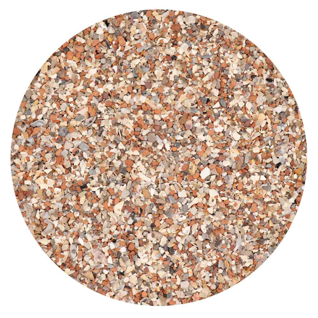 Primer plano de la textura del Grit para palomas Versele-Laga Colombine, mostrando el redstone y minerales esenciales.